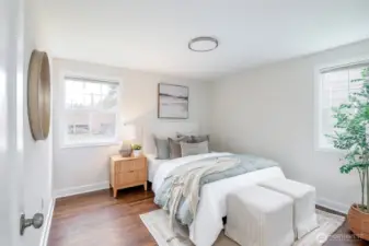 Bright and versatile main level bedroom for guests or home office.