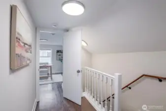 Upstairs landing with charming architectural detail.