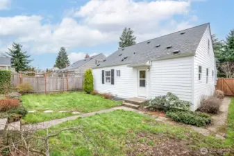 Generous yard space ready for gardening, entertaining, or play.