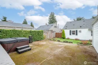 Entertaining ready outdoor space with room to host and relax. Hot tub stays with home.