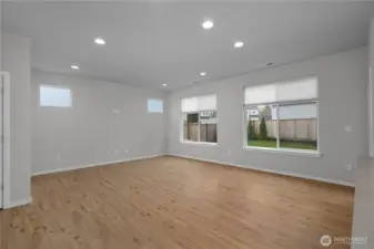 Spacious open-concept living area with abundant natural light and flexible space for everyday living and entertaining.