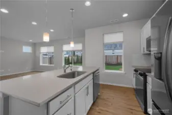 Open kitchen design with clear sightlines to the living area, enhancing everyday flow.