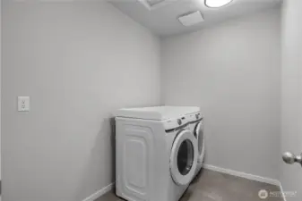 Dedicated laundry room with full-size washer and dryer upstairs.