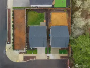 Aerial view showcasing private lot and fenced yard.