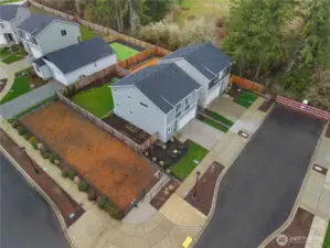 Aerial - showing the raised beds on the warm South side of the home.