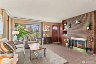 Living room features a wood burning fireplace and solid wood built-ins
