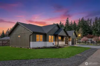 Single level, large 3 car garage, and 3 car driveway, level lot. Stone façade. Lighting in each gable (tip of the roof).