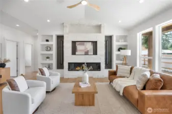 Large stone fireplace anchors the living area. Contemporary lighting and fixtures, custom builtins.