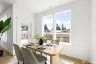Dining area with outdoor patio access.