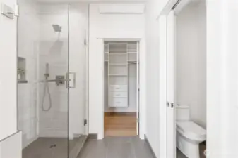 Custom tile baseboards. Full-Height tiled shower and shower pan, custom glass doors, recessed shower niche. Upgraded luxury 3-point shower system (rainfall, regular, and handheld). Separate toilet room with pocket door.