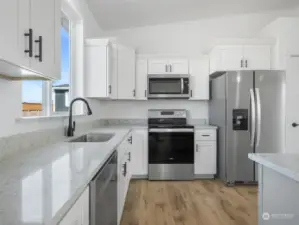 Granite counter tops with rubbed oil bronze fixtures.