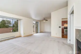 An open floorplan seamlessly flows into the dining area and kitchen.