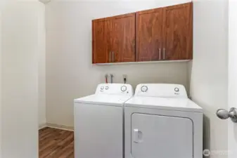 Laundry Room with plenty of space to add more shelving for storage!