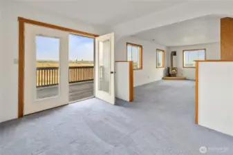 Primary Bedroom with its own living room, balcony and free standing stove.