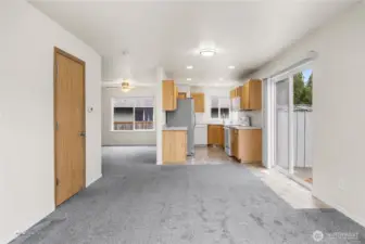 Looking from family room, half bath is door to left