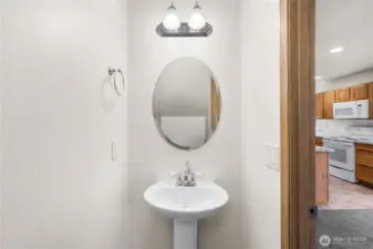 Powder room with automatic lighting and pedestal sink