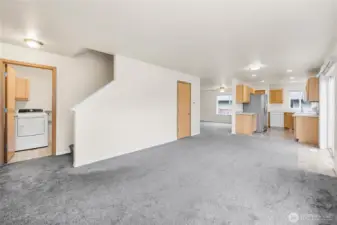 Stairway to go upstairs from utility/mud room