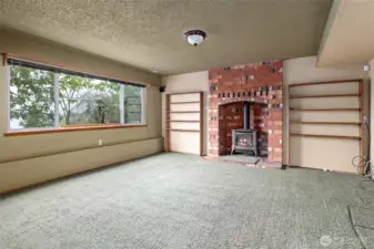 Family room /guest suite you decide.  Lopi free standing propane stove.  4th Bedroom is to the right.