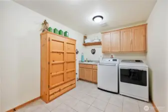 The oversized laundry/mud room is conveniently located off the garage and close to the primary bedroom.