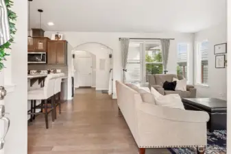 As you enter, you will find a great open-concept layout, your family room on the right, kitchen and dining on your left. I LOVE the large windows in this home! Flooring is beautiful as well.