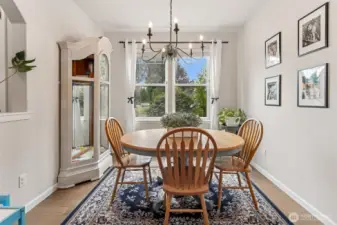 Formal Dining Room view from the kitchen, faces the front of the home and note the opening to the entry on your left.