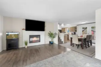 Living room has an electric fireplace with blower for warmth