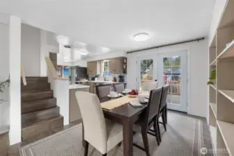 Stairs right off dining room lead to the upper level bonus loft