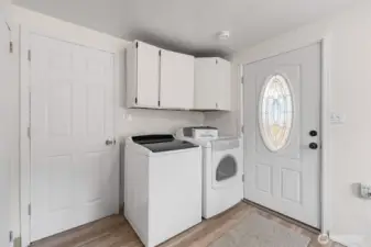 Laundry area right off the kitchen with door leading to dog run.