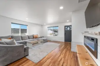 Fully updated, with LVP flooring/electric fireplace and raw edge mantel