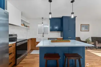 Custom cabinetry, custom light fixtures, and quartz counters