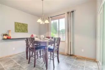 Dining room with sliding glass door leading out to the backyard