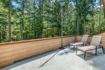 Main ensuite's private deck over looks the natural forest.