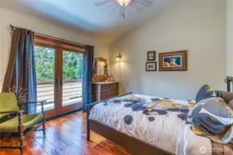 One of two guest bedrooms. French doors open up to private deck.