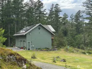 2 car garage with large RV bay, shop, laundry, upper ADU guest studio.