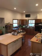 Lower basement space is used as an art studio with additional room as office. 3/4 bath with plenty of storage and separate entrance from the upper levels of the home.