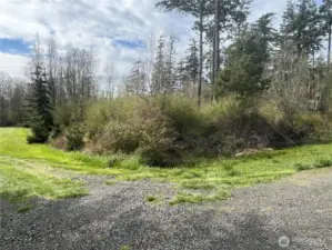 Property view looking NW. Grass area is the neighbor to the south