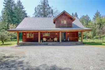 Unique log home with welcoming front porch!