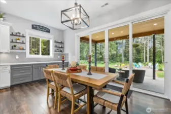 Coffee bar or extra kitchen area with shelving opens to the massive open space out back.  Room for your extra large dining table for those big gatherings.