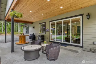 Massive covered porch with tongue and groove ceiling offers recessed lighting as well.
