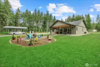 Imagine all your summer gatherings under the covered porch and next to the fire pit!  Do I smell the S'mores already?