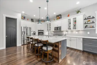 Open concept kitchen featuring walk in pantry and coffee bar.  All quartz countertops and thoughtful touches.