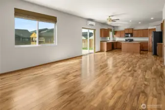 The main floor great room is open to the dining and kitchen