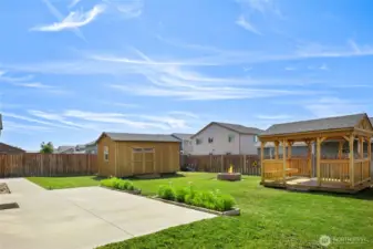 A quick look at the back yard with the oversized patio (with a retractable awning!) and the gazebo, firepit and storage/workshop building!