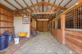 Inside barn with 2 stables, room for hay, storage and more.