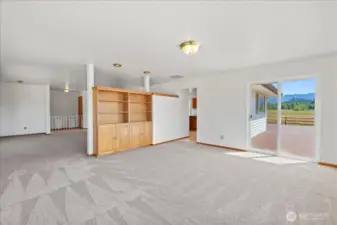 Family room leading to back deck, kitchen and living room.