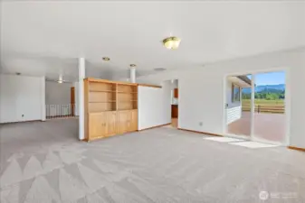 Family room leading to back deck, kitchen and living room.