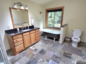 primary bath suite with slate floors, claw tub