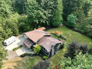 Extremely private 1.59 acre estate with large driveway, RV parking, two car garage, beautiful manicured grounds with room to roam.
