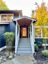 Inviting covered entry with tongue and groove ceiling is thoughtful, functional and gorgeous. Your oasis awaits!