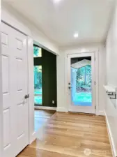 Light floods the entryway from the glass front door... another example of the thoughtful design of this elegant home.